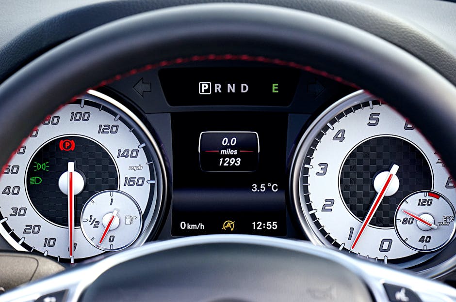 Detailed view of a car's dashboard showing speedometer, odometer, and controls.